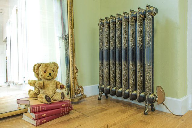 Electric Rococo ornate cast iron radiator in burnished gold